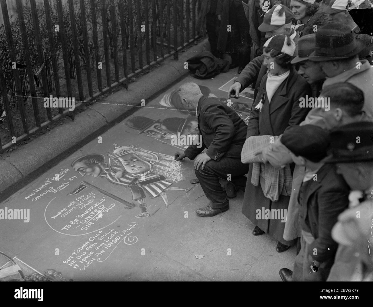 Pavement Artist ' s ' prophecy ' wins approval ( and pennies ) . A pavement artist with a topical turn of mind did a brisk ' buisness ' on Tower Hill when crowds of Shefield Cup Final supporters stopped to admire his drawing of Harry Hooper , the Sheffield captain ' wedded to the F A Cup . Photo shows , Sheffield supporters looking at the pavement drawing on Tower Hill . 25 April 1936 Stock Photo