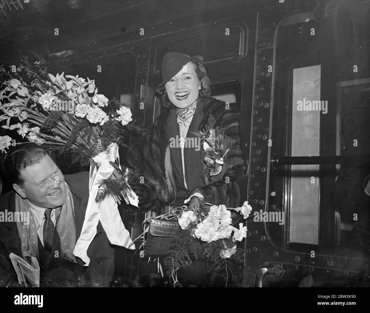 Radio ' Air do well ' leaves for American broadcast tour . Effie Atherton of the radio ' Air do Wells ' party left Waterloo Station , London , on the Lafayette boat train with her husband , Leslie Londau , of fox films for America , where she is to broadcast with Jack Aylton , the band leader . The engagement is a result of a Trans Atlantic telephone talk with Jack Hylton , who is at present in Chicago . Effie Atherton is well known over the Empire broadcasting system . Photo shows , effie ATherton photographed at Waterloo . 8 January 1936 Stock Photo