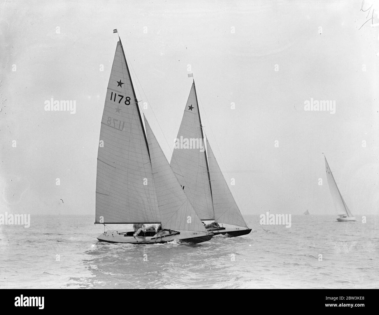 Yachts compete in Olympic games trials at Burnham on Crouch . The Olympic Games eliminating trials for six meter , monotype and star class yachts held under the suspices of the Royal Corinthian Yacht Club , took place at Burnham on Crouch , Essex . The races are being held to choose the best representatives among those entered to race at Kiel in the August Olympic games . Photo shows , Lady Betty ( 1178 ) owned by Colin Ratsey and another international star slass yacht rounding a buoy during the races at Burnham . 13 May 1936 Stock Photo