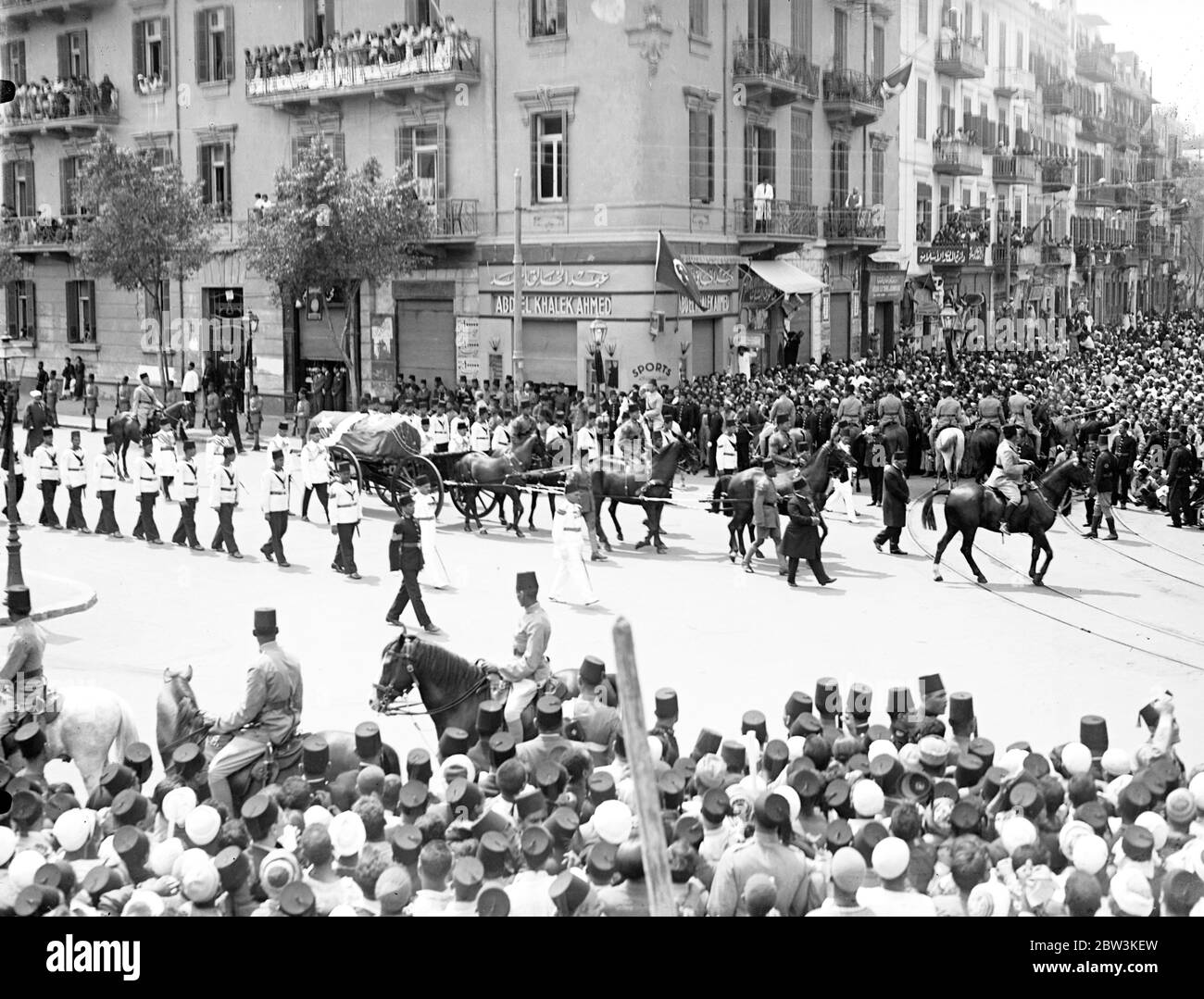 King Fuad of Egypt buried in Cairo . Dense crowds pack five mile route . Borne on a gun carriage drawn by six magnificent black horses through five miles of densely packed streets , the body of King Fuad of Egypt was taken with impressive oriental pomp from the Abdin Palace , the official residence , to the Rifai Mosque for burial in the mausaleum he prepared for himself years ago . As the cortege moved off , led by the Camel Corps , 21 minute guns sounded from the barracks and Egyptian Air Force planes roared overhead . Prince Mohammed Ali , the heir presumptive with members of the Royal Fami Stock Photo