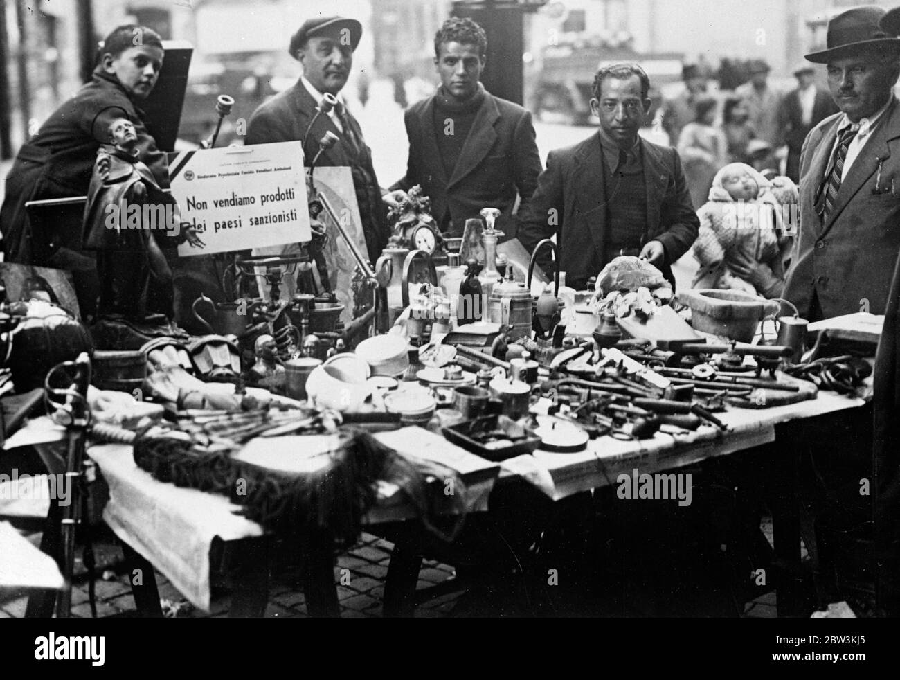 Italy conducts intensive campaign against sanctionist countries . Even the old  junk  stall in a Roman street has its  anti sanctions  notice . 24 November 1935 Stock Photo