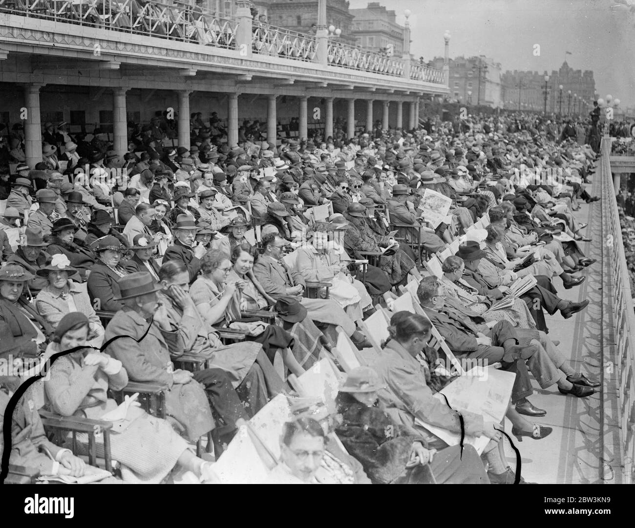 Holiday Crowds Find the Sun at Eastbourne Although London shivered in cold wind thousands of visitors found the sun in holiday mood at Eastbourne. Large crowds thronged the beach . Photo Shows : The packed front at Eastbourne today ( Whit - Sunday ) 31 May 1936 Stock Photo