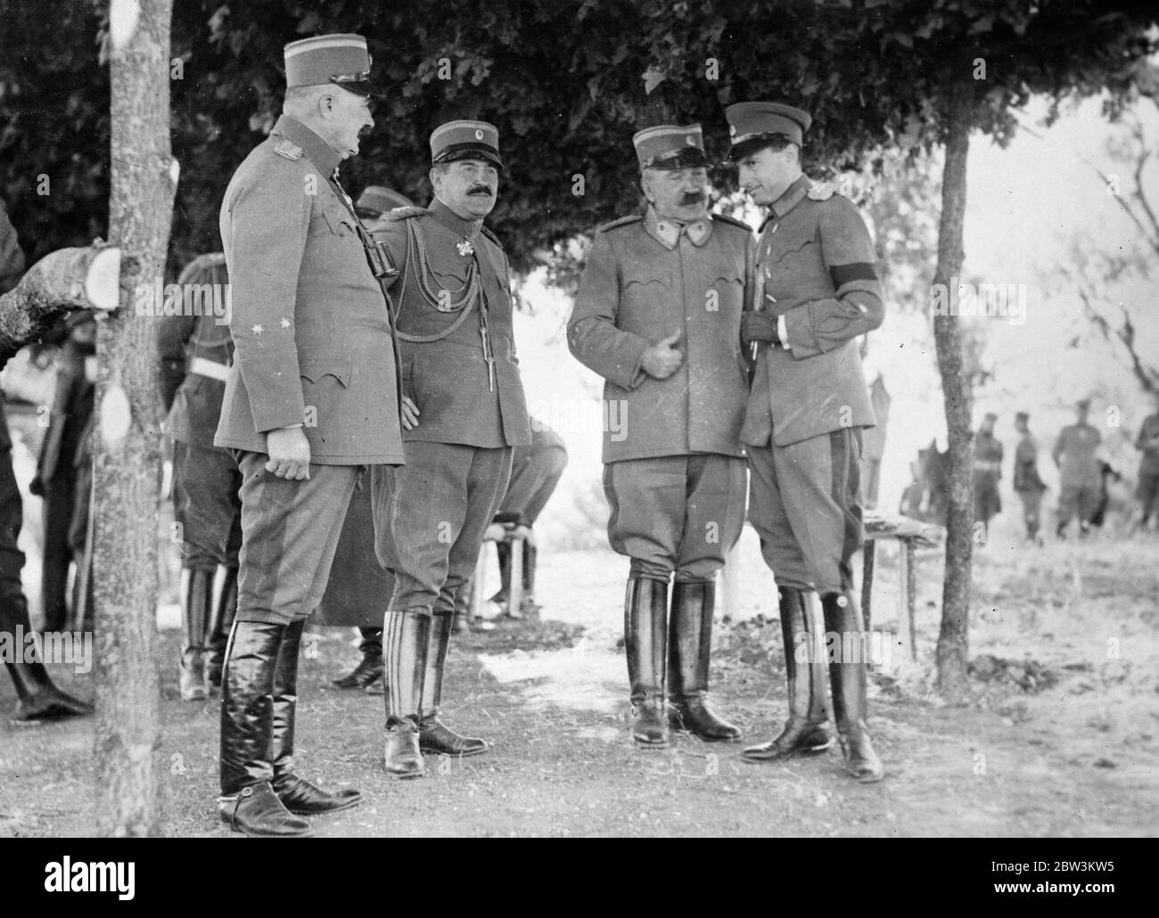 Prince Paul at great Jugoslav army manoeuvres on Hungarian frontier . Prince Paul ( right with mourning band for King Alexander ) talking with General Jivkovitch , Jugoslav War Minister , and other generals at the manoeuvres . 5 October 1935 Stock Photo