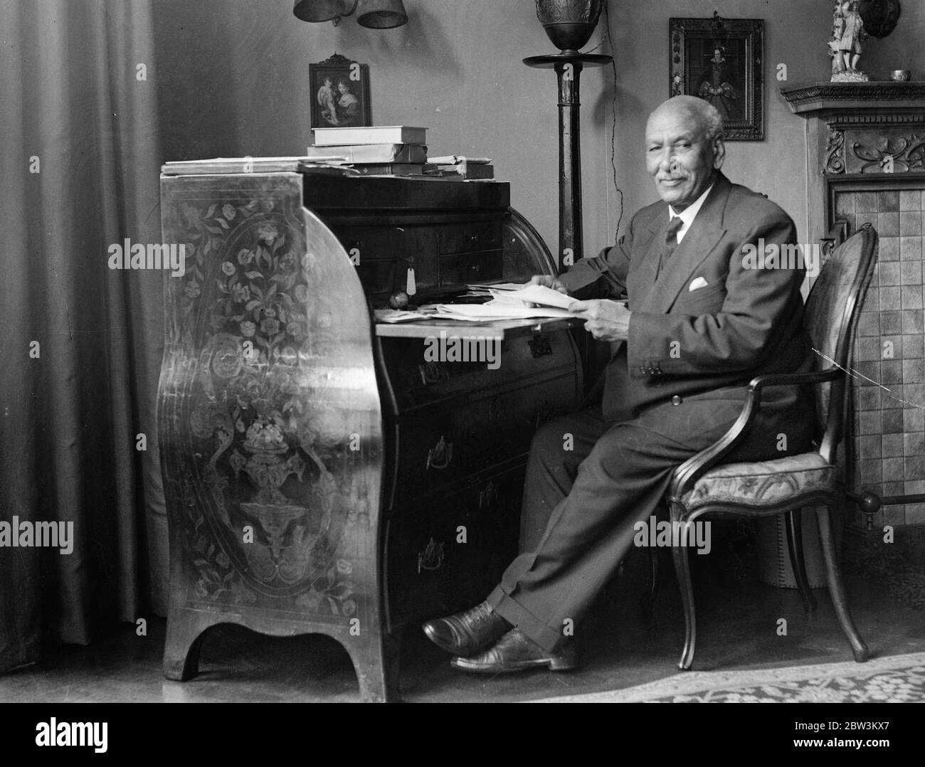 Abyssinian envoy here to raise £ 2 , 000 , 000 in war loans . Photo show Dr Azaj Wargneh C Martin at work in his room at the Legation . 22 July 1935 Stock Photo