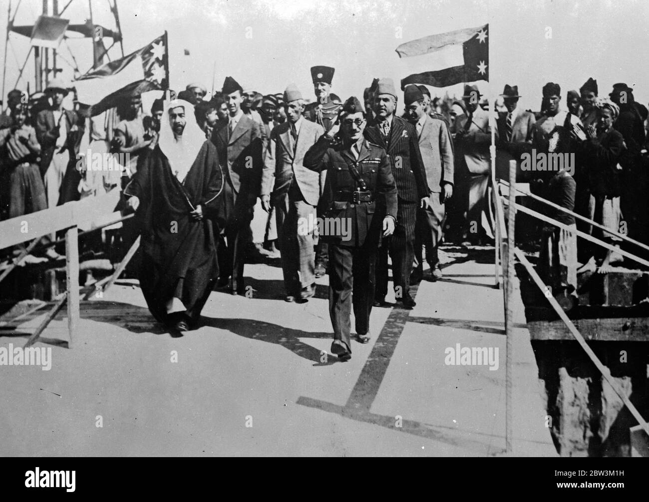 King of Iraq opens a new barracks - making his country an armed power . King Gazi leaving after the opening of the new barracks , Conright is his uncle , the Emir Ahdellah , and left the King of Transjordiana . 23 December 1935 Stock Photo