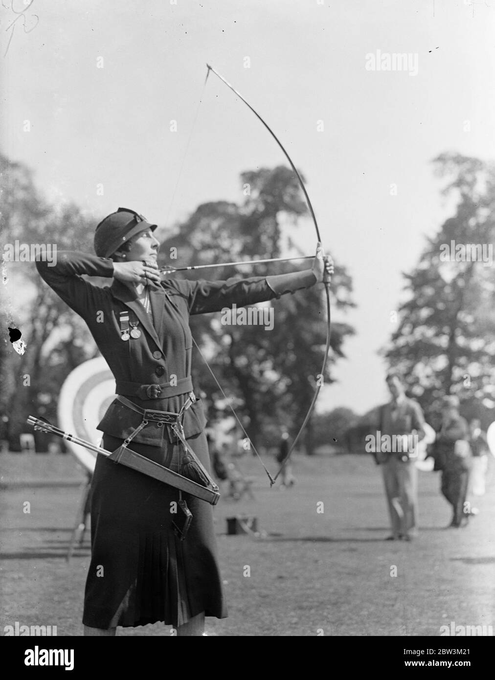 Woman competitor draws the bow at Ranelagh archery meeting . Mrs Ingo Simon drawing her bow . 14 May 1936 Stock Photo