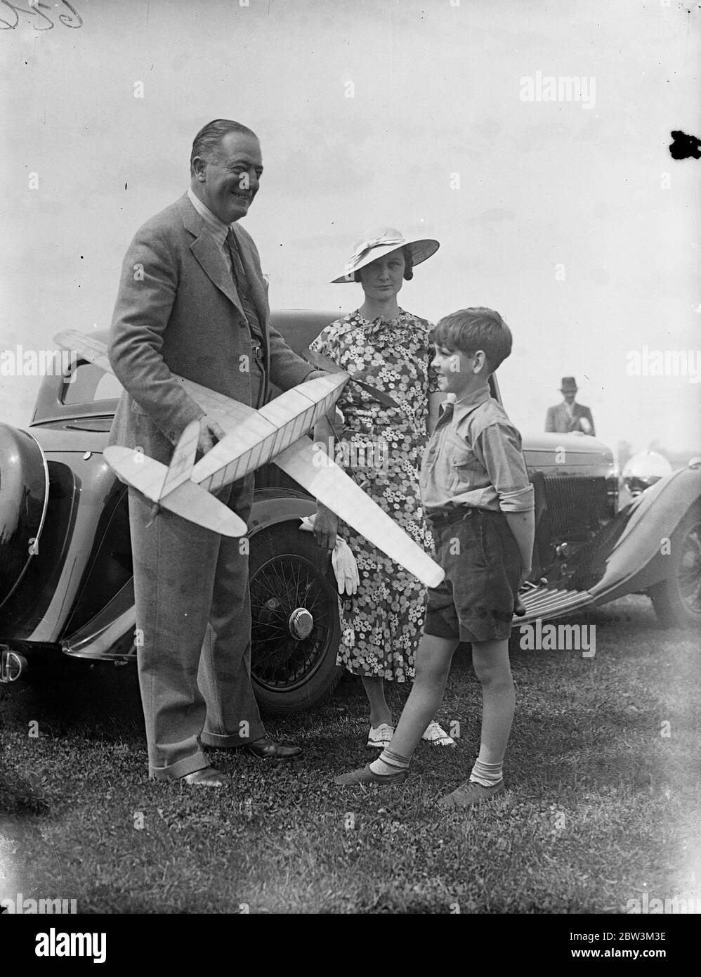 Model plane enthusiasts compete at Hayes . Hope to enter British team to recapture Wakefield trophy . Over a hundred model aeroplane enthusiasts from every part of the country took part in the Elimination trials for the Wakefield International Trophy held at the Fairey Aerodrome , Hayes , today ( Sunday ) . From the successful competitors Great Britain ' s team to attempt the recapture of the Wakefield Trophy from America , will be chosen . The international contest takes place at Akron , Ohio on June 30 . Photo shows , Peter White , a nine year old competitor , demonstrates his model plane to Stock Photo