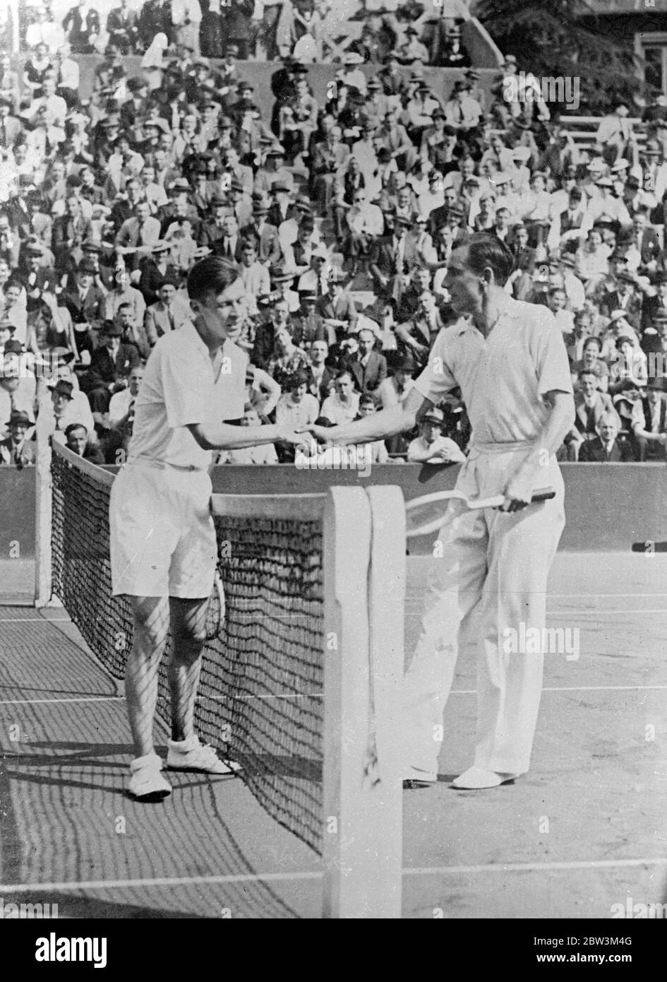 Perry and Austin , leading British players , defeated in Paris tournament . Fred Perry and H W Austin , Britain ' s leading tennis playes , were both defeated in the tournament between the International Clubs of Great Britain and France at the Stade Roland Garros in Paris . Perry was defeated by Christian Boussus , the French champion , 6 - 4 , 6 - 8 , 6 - 2 and Austin fell before Bernard Destremeau in two sets 8 - 6 , 6 - 2 . Photo shows , Perry ( right ) congratulating Boussus after their match . 17 May 1936 Stock Photo