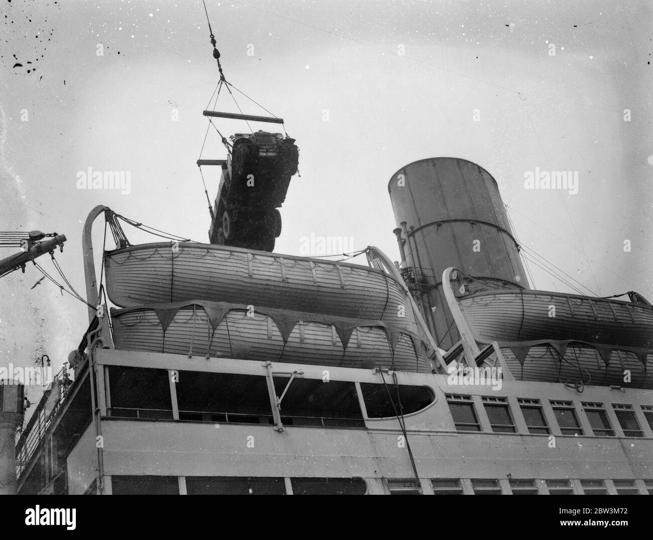 Scythia , famous luxury liner , converted to troopship . Army lorries loaded . Army lorries alongside Scythia , at Southampton , ready to be swung aboard . 6 January 1936 Stock Photo