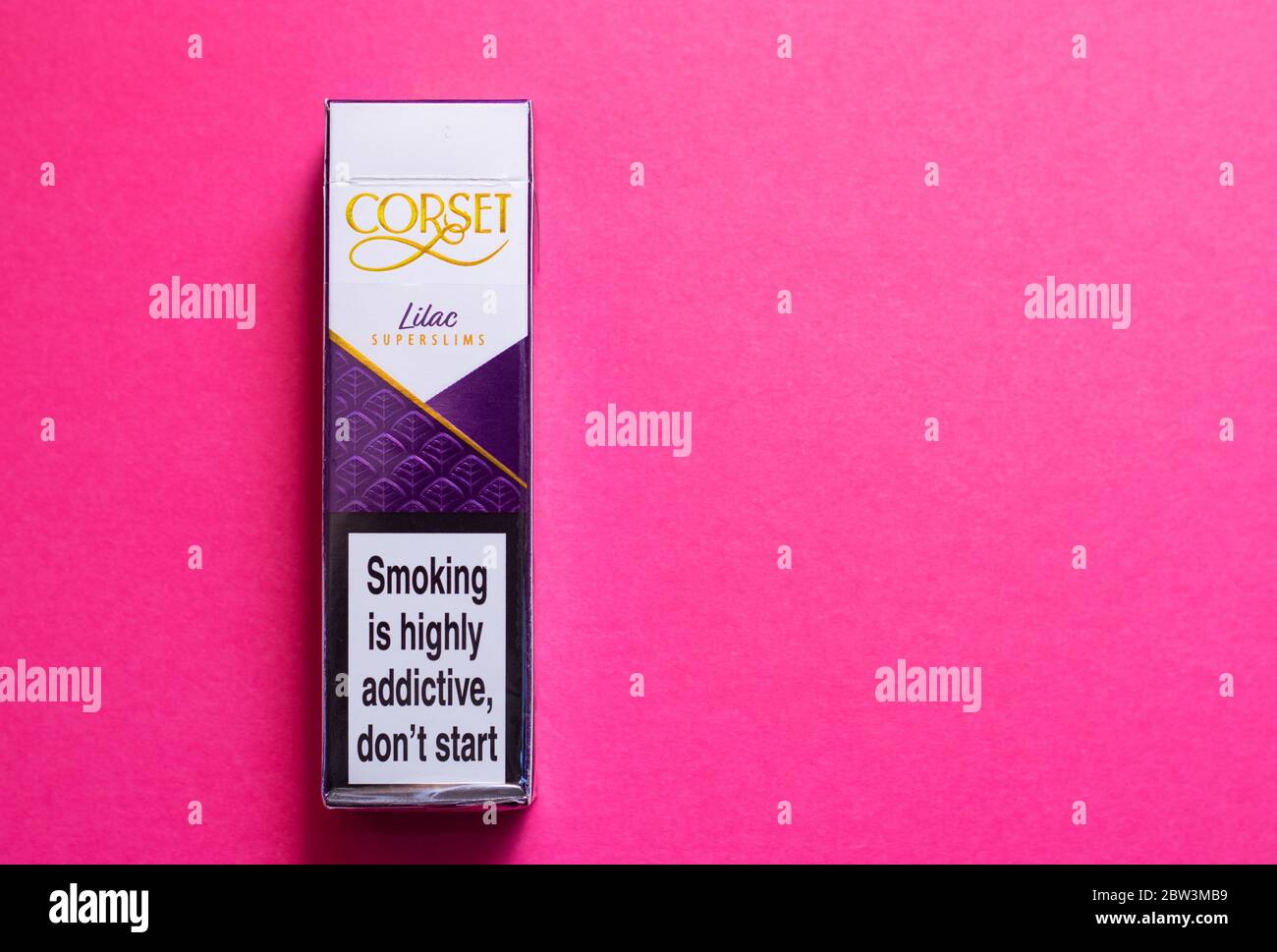 Box of Corset superslim cigarettes on a pink background Stock Photo - Alamy