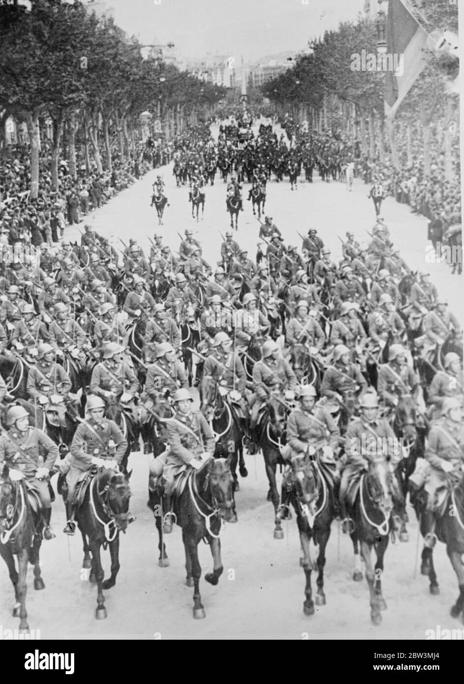 Military parade in Barcelona to celebrate fifth anniversary of republic . The troops marching through the crowd lined streets of Barcelona . 16 April 1936 Stock Photo