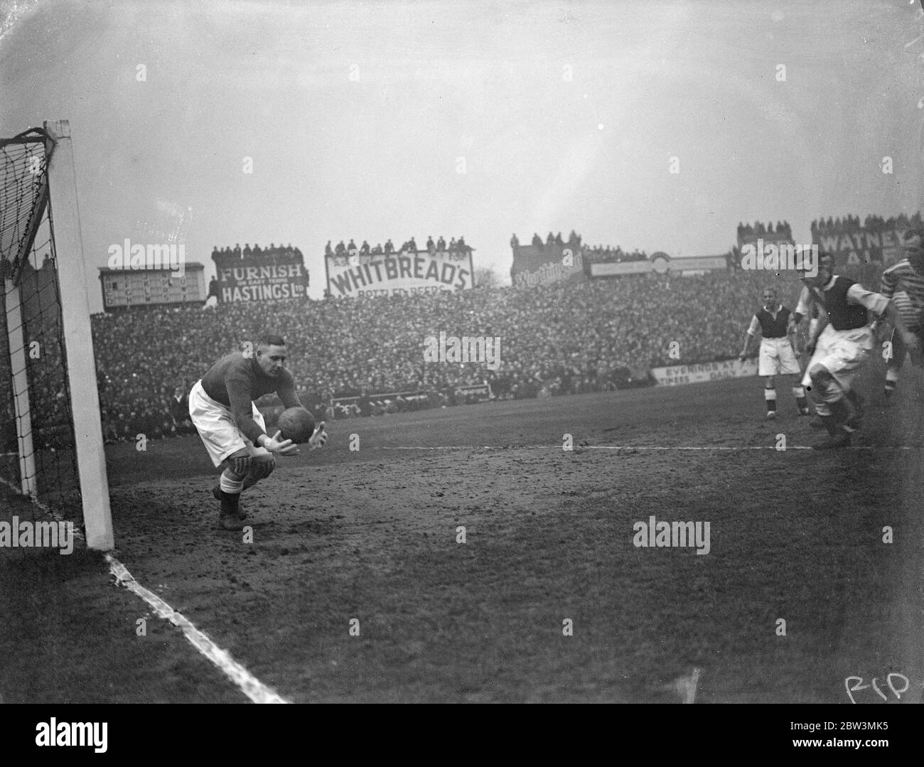John Kirby in action at Craven cottage . Fulham met Drby County in the sixth round of the F A Cup competition at Craven Cottage , London . Photo shows John Kirby , the Derby goalkeeper saving a shot . 29 February 1936 Stock Photo