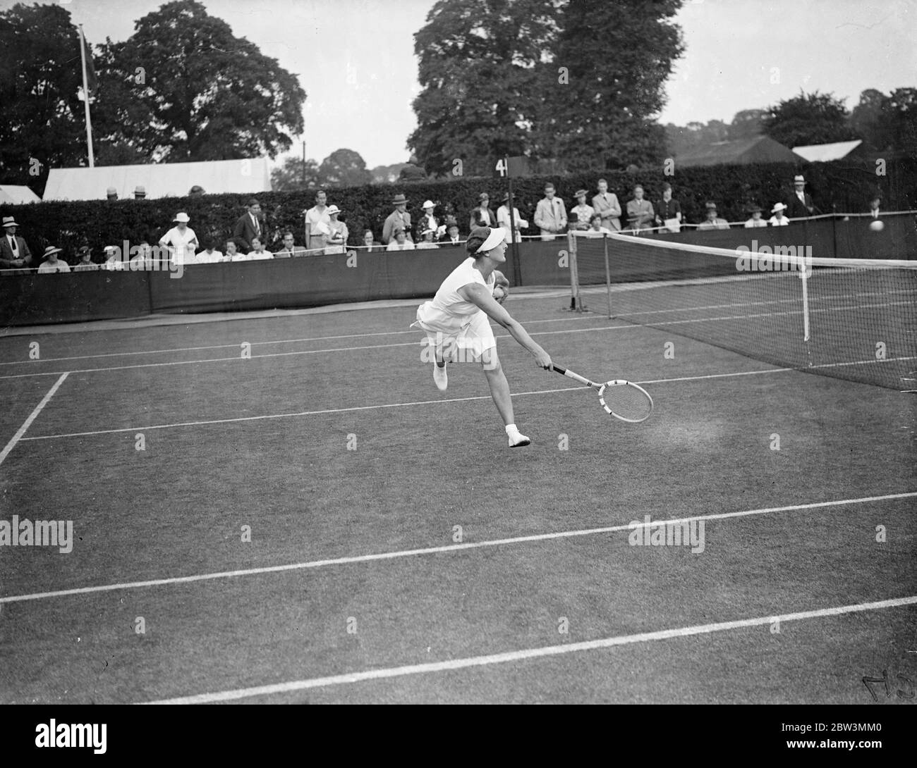 Miss Riddell Meets Polish Woman Player In Wimbledon Championships . This was women ' s day at Wimbledon , a number of players of international repute making their appearance in the championships . Photo Shows : Miss . Mona Riddell in play against Miss Jadwiga  Jed  Jedrzejowska of Poland . 23 Jun 1936 Stock Photo