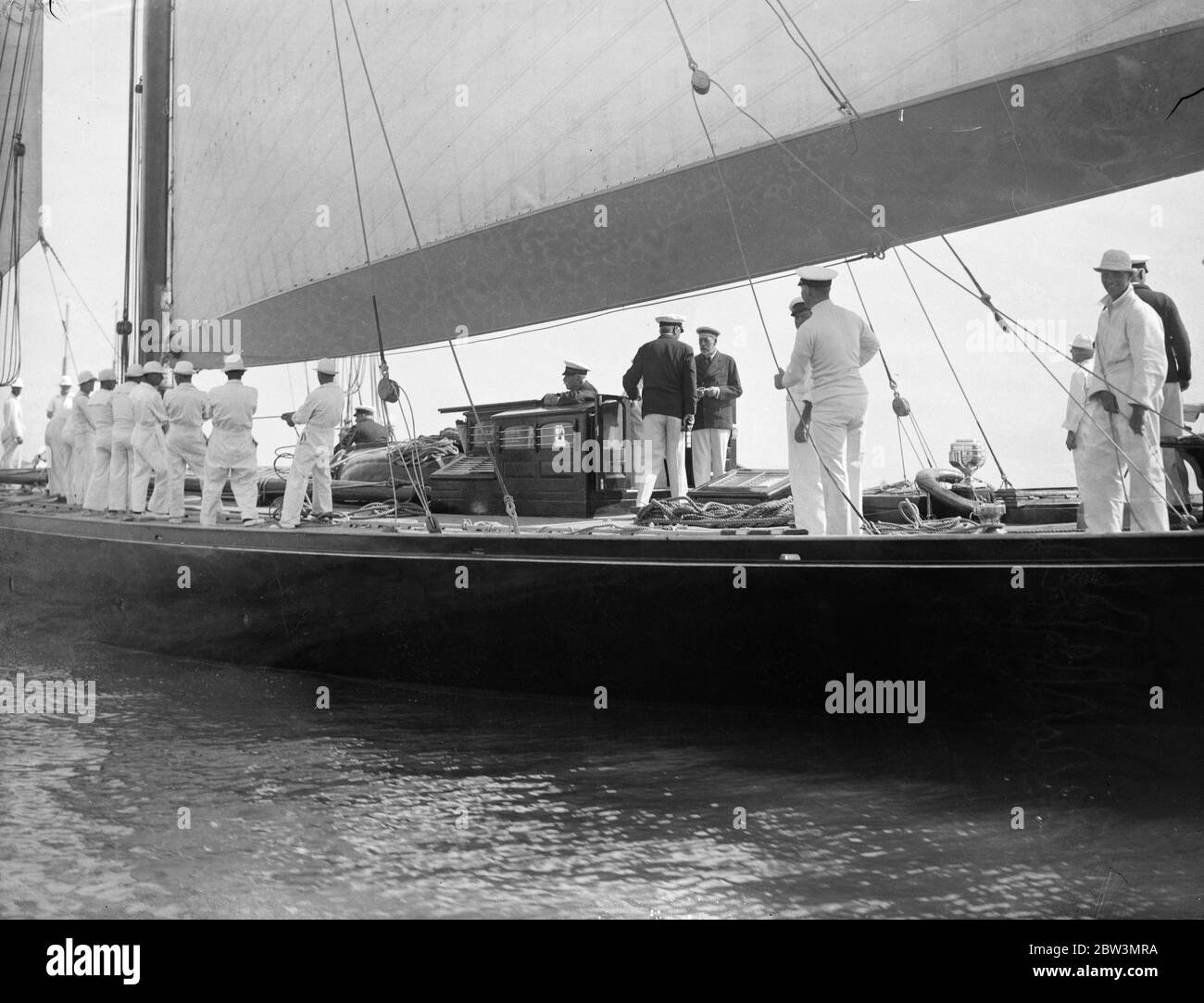 The King himself was at the helm of his half century old yacht Britannia when she competed against the American cutter Yankee and other famous big yachts in the races of the Royal Thames Yacht club of Ryde onthe Isel of Wighty . 31 July 1935 Stock Photo