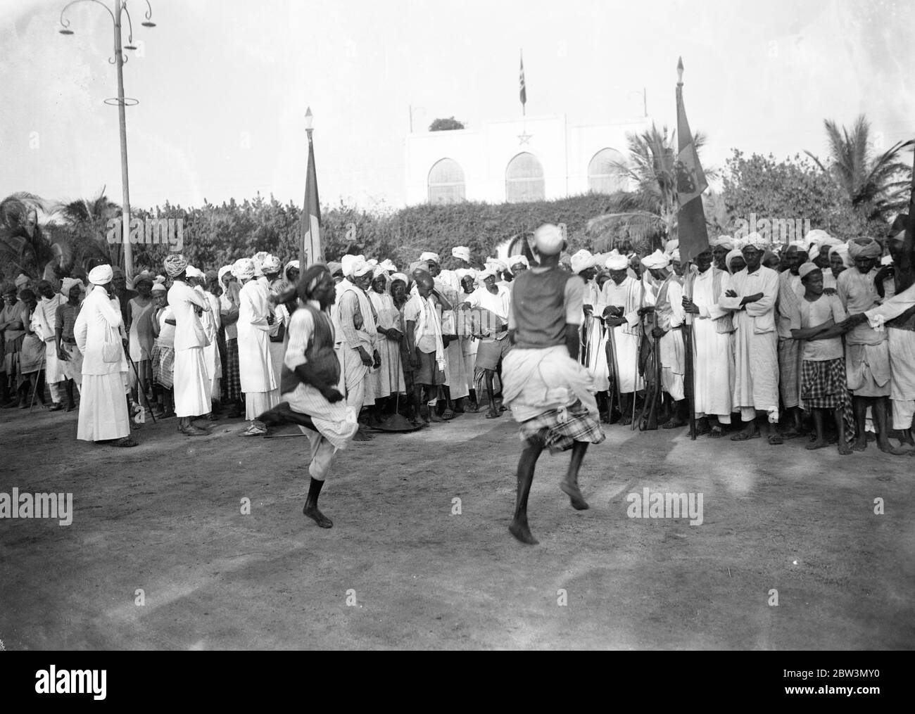 Marshal Badoglio welcomed with native war dance . Natives of Massawa performing their war dance in welcome to Marshal Badoglio . 6 December 1935 Stock Photo