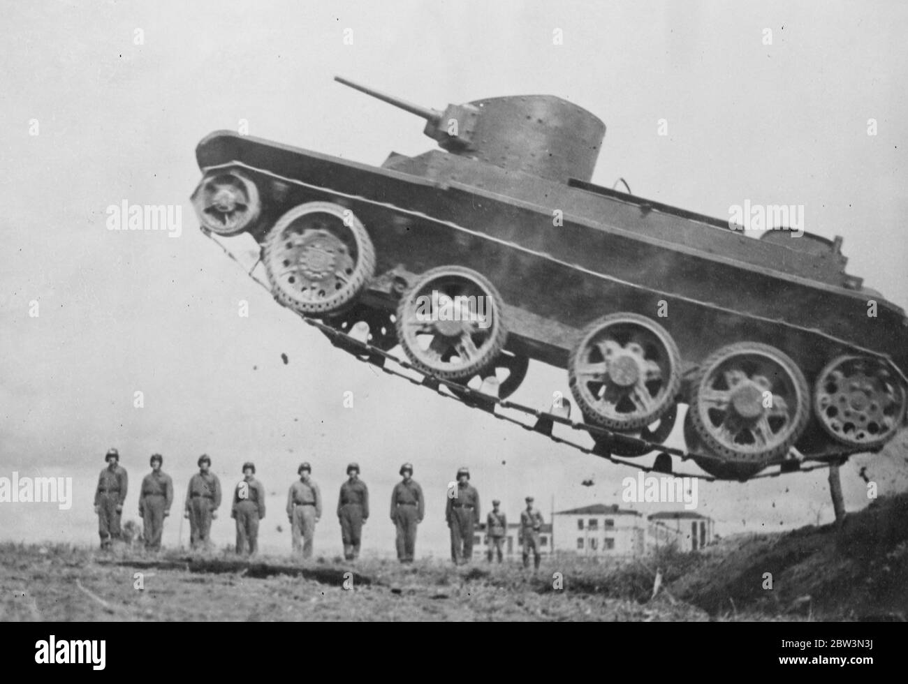 Tanks in flight - Russia 's steel giants in daring exercises . A giant tank high in the air after crashing over an obstacle . 24 October 1935 Stock Photo