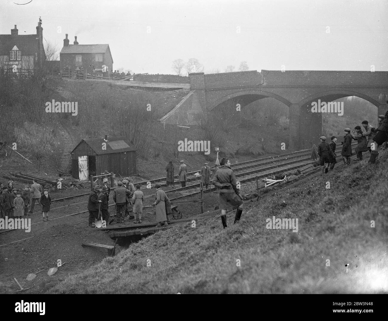 Devizes bridge collapsing through heavy rains . Great cracks in roadway ...