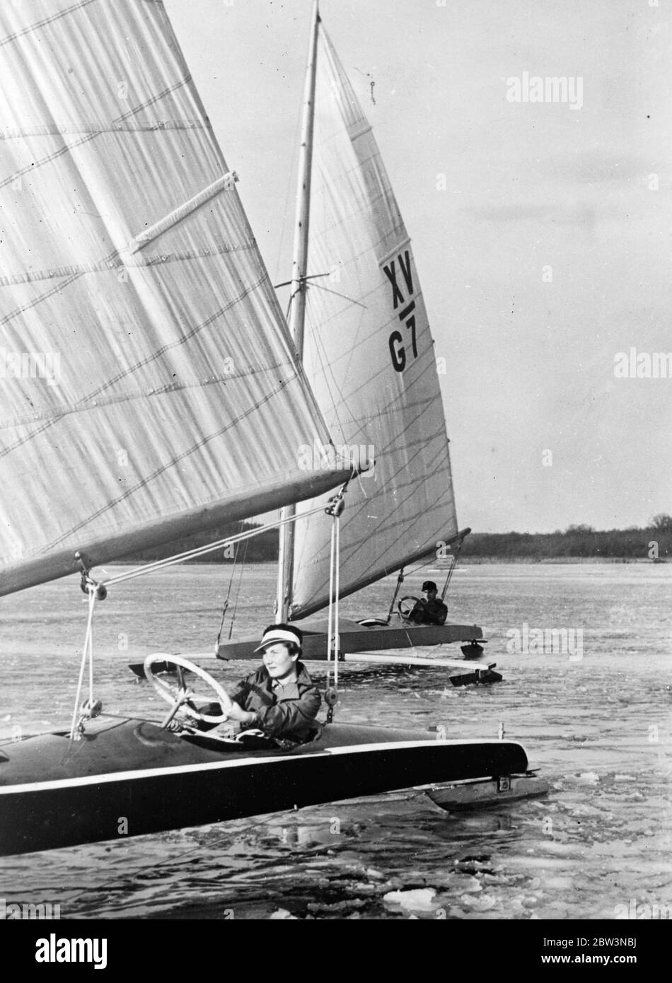 Ice yachting refatta in wintry Germany . The cold is so intense in Germany that ice yacgting enthusiasts from Berlin held a regatta on the frozen Bangadorfer See . Photo shows , Ice yachts skimming over the frozen Bangadorfer See . 31 December 1935 Stock Photo