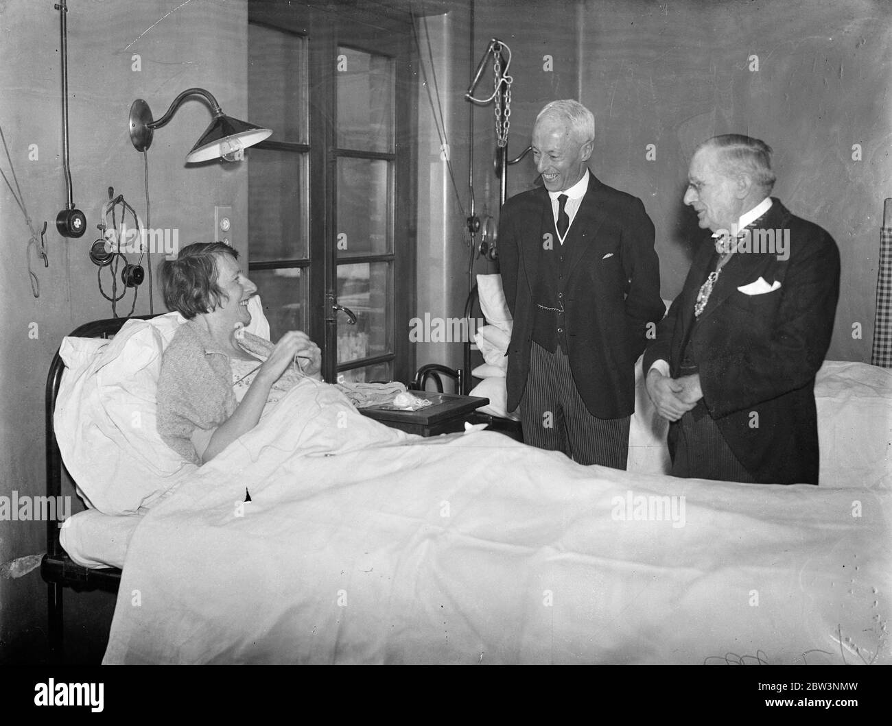 Lord Mayor visits city hospitals . The Lord Mayor , Sir Percy Vincent , shaking hands with Mrs Swanell during his tour of St Mark 's Hospital . On right is the Lady Mayoress . 19 March 1935 Stock Photo