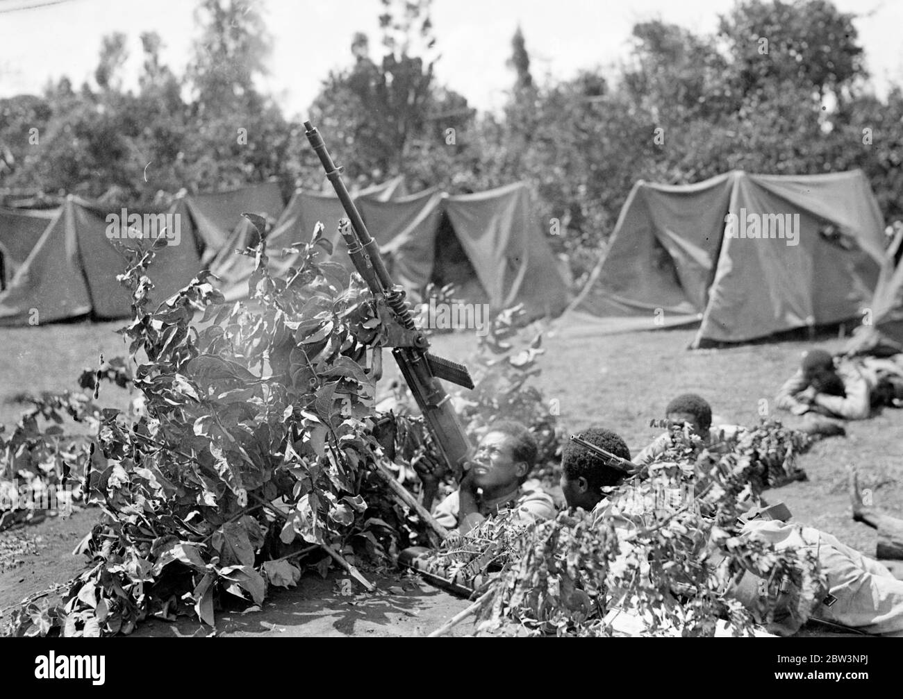 Ras Nasibu ' s army reported crushed by Graziani . the army of Ras Nasibu on the southern Abyssinian front is now reported to have been crushed by the Italian forces of General Graziani , which are now said to have take Jijiga , the key to Harar and the Addis Ababa Jibuti railway line . These photos of Ras Nasibu ' s army , which for months blocked the advances of the Italian forces in the south , were taken several months ago on the southern front and have never been published . Photo shows , an anti aircraft gun emplacement in Ras Nasibu ' s . 20 April 1936 Stock Photo