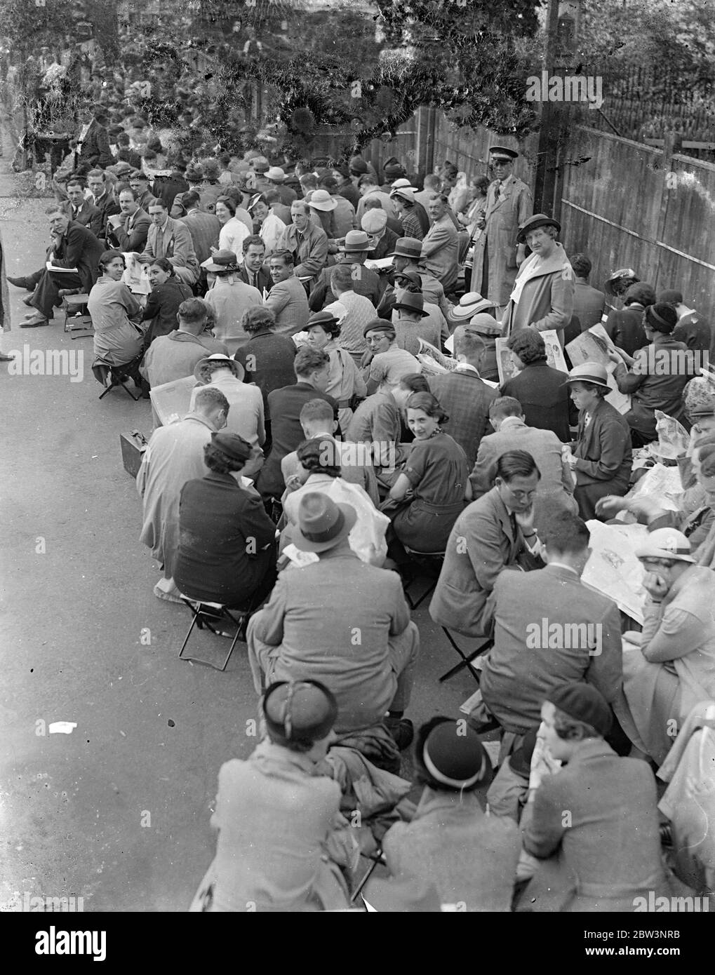 Early Queues For Last Day of Wimbledon . There were big queues at Wimbledon from the early hours for the last day of the tennis championships . Among the titles to be decided is the women ' s singles . Photo Shows : The early crowd at Wimbledon 4 Jul 1936 Stock Photo
