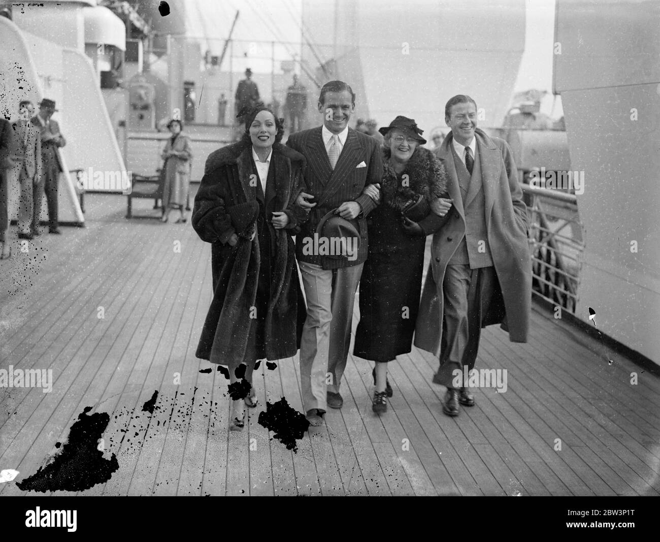 Dolores Del Rio Leaves For America After Work On British Film . Dolores del Rio , film actress , who has been working in British studios , left Southampton for America aboard  Queen Mary  is making her second voyage to the United States . Photo Shows : Dolores del Rio with Douglas Fairbanks Jr . and Anna Beth Sully and Jack Whiting ( Douglas ' s mother and step - father ) aboard  Queen Mary  at Southampton . 17 Jun 1936 Stock Photo