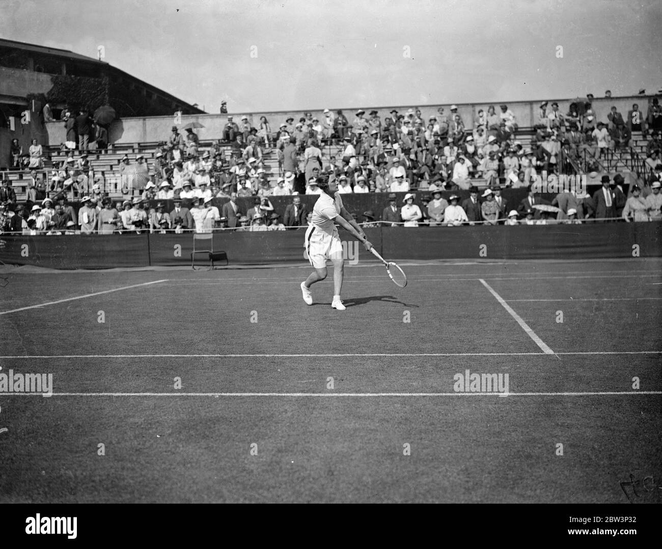 Helen Jacobs Defeats Mrs . Cable In Wimbledon Championships . Miss Helen Jacobs ( USA ) defeated Mrs . M . Cable of Great Britain 6 - 1, 6 - 0 in the first round of the women ' s singles in the Wimbledon Tennis Championships . Photo Shows : Miss Helen Jacobs in play against Mrs . Cable 23 Jun 1936 Stock Photo