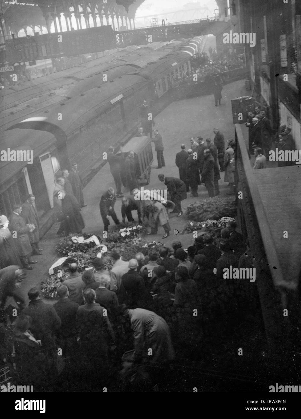 Bodies of five boys who lost their lives in mountain blizzards arrive in London . The bodies of the five London schoolboys who lost their lives in the blizzard on a Black Forrest mountain arrived at Liverpool Street Station after having been brought home from Freiburg , Germany . With the bodies were wreaths from Hitler , Sir Eric Phipps , the British Ambassador in Berlin and parents of the boys . Photo shows a coffin , draped with the Union Jack , being unloaded from the train at Liverpool station . 22 April 1936 Stock Photo