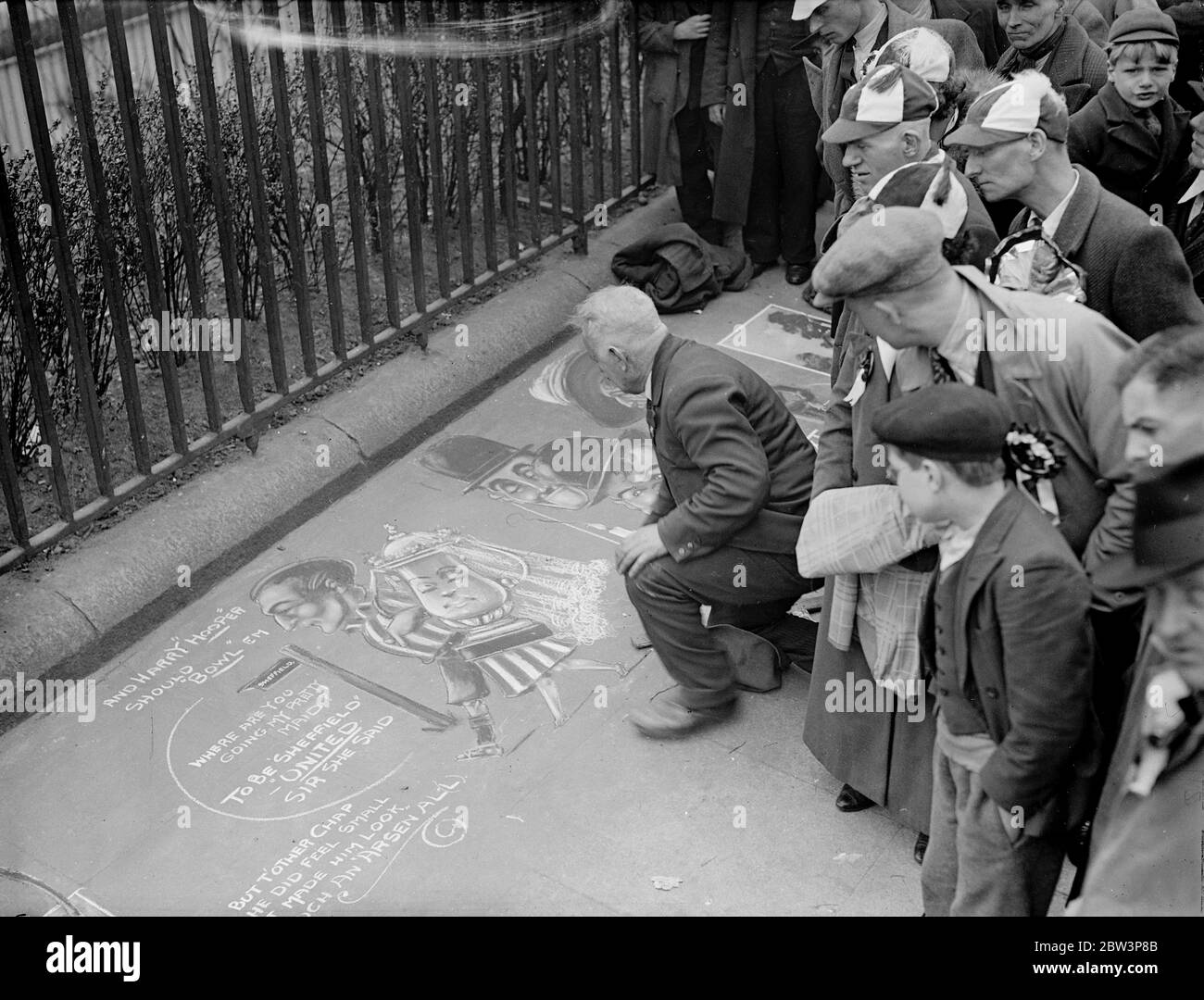 Pavement Artist ' s ' prophecy ' wins approval ( and pennies ) . A pavement artist with a topical turn of mind did a brisk ' buisness ' on Tower Hill when crowds of Shefield Cup Final supporters stopped to admire his drawing of Harry Hooper , the Sheffield captain ' wedded to the F A Cup . Photo shows , Sheffield supporters looking at the pavement drawing on Tower Hill . 25 April 1936 Stock Photo