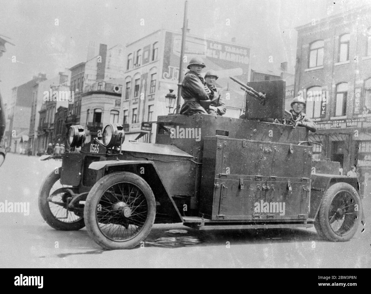 Armoured Cars Patrol Strike - Ridden Liege . Armoured cars , manned by steel - helmeted troops , are co- operating with the police in patrooling the streets of Liege , centre of the Belgian strike area , where mobs of strikers have been demonstrating . Although the prospect of a general stoppage has been averted , many workers in the industrial areas are still on strike . Photo Shows : An armoured car with its steel - helmeted crew on patrol in a Liege street . 22 Jun 1936 Stock Photo