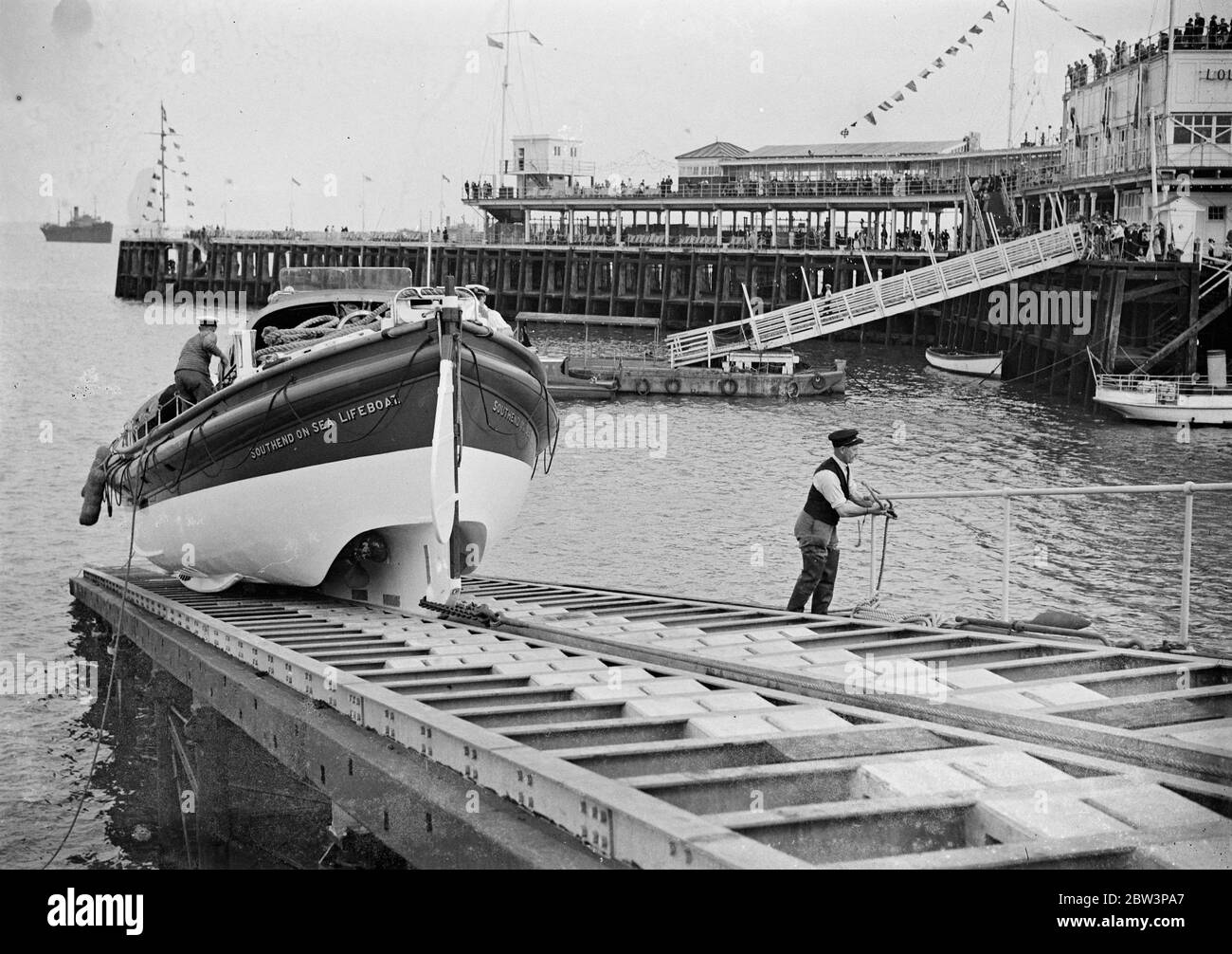 A centenary treat for school children at Southend on Sea. Over a thousand children watched a special launch of the lifeboat as part of the celebrations . . 31 July 1935 Stock Photo