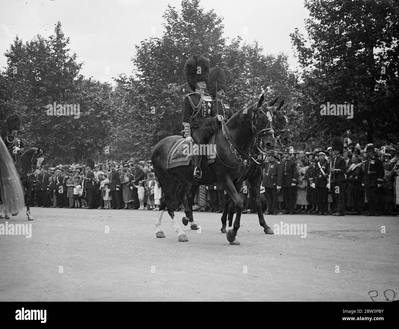 King At First Trooping Of The Colour As Monarch For the first time as monarch King Edward VIII took part in the Trooping of the Colour ceremony at the Horse Guards Parade in honour of his 42 nd birthday . His Brother the Duke of York , The Royal Dukes , the military attaches of Foreign Powers and Colonels of the Guards Regiments accompanied him om horseback . Photo Shows : The King leading the procession along the Mall to the Horse Guards . 23 Jun 1936 Stock Photo