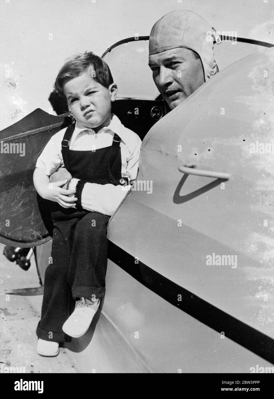 Richard Arlen , once British flying officer , takes small small son for first flight . Richard Arlen , the film actor who has been an airmen since he was 14 years of age , took his infant son , 2 1 / 2 years old , Richard Junior , for his first flight at Hollywood . Arlen senior , served as a lieutenant in the British Flying Corps during the war . Photo shows , Richard Arlen and his small son Richard Junior , after their first flight together . 27 December 1935 Stock Photo
