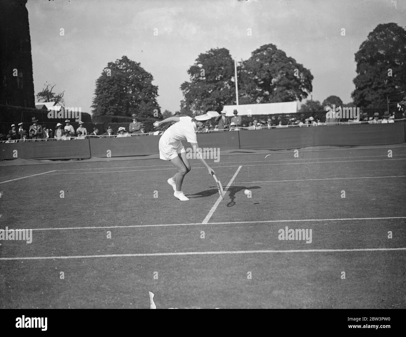 Helen Jacobs Defeats Mrs . Cable In Wimbledon Championships . Miss Helen Jacobs ( USA ) defeated Mrs . Cable of Great Britain 6 - 1 , 6 - 0 in the first round of the women ' s singles in the Wimbledon Tennis Championships Photo Shows : Mrs . Cable in play against Helen Jacobs . 23 Jun 1936 Stock Photo
