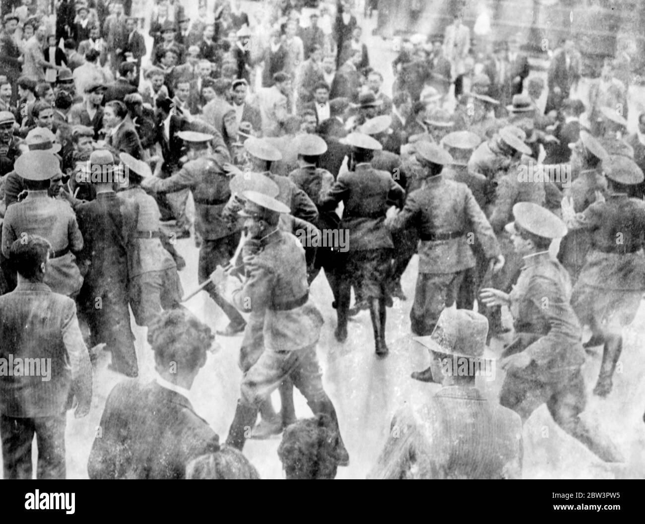 Police attack demonstators in Athens . Salonika troubles spread to capital . A large force of Athens police attacking a crowd of demonstators . 15 May 1936 Stock Photo