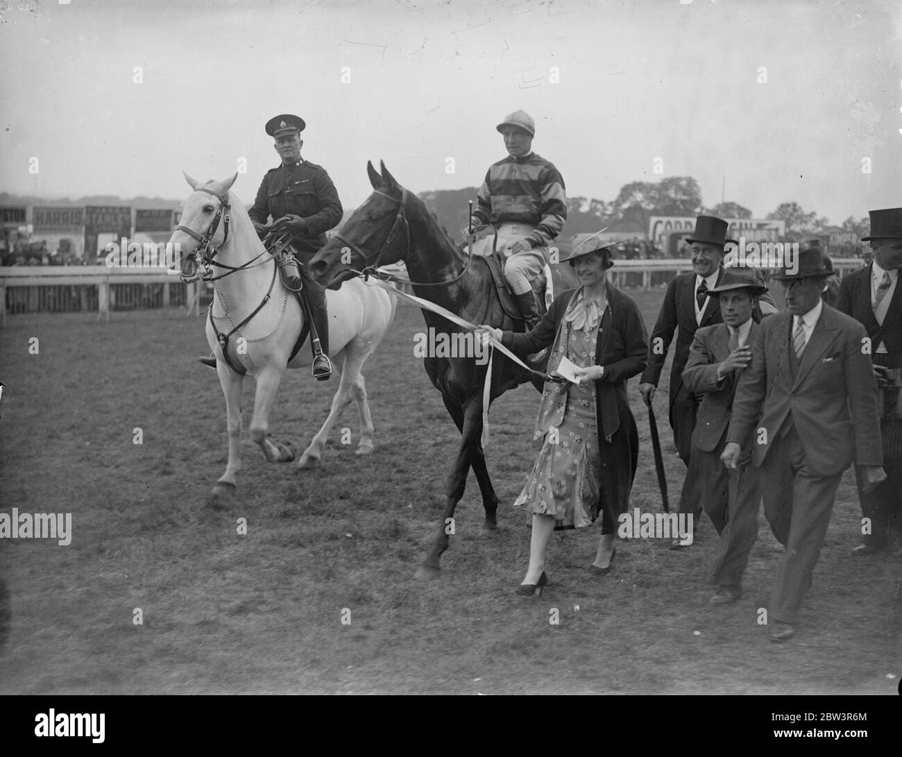 Lady Bailey leads in lovely Rosa , Oaks winner . Sir Abe Bailey ' s Lovely Rosa , ridden by T Weston , won the Oaks at Epsom . Harrowby Gem , owned by Sir Frederick Eley and ridden by F Fox , was third . Photos Lady Bailey leading in her husband ' s horse , Lovely Boss , after her victory . 29 May 1936 Stock Photo