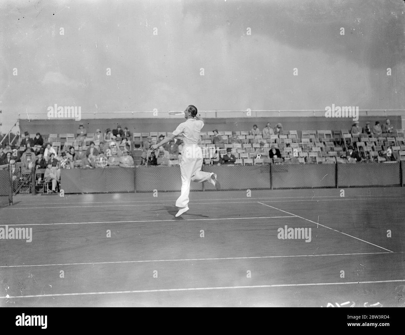 Fred Perry beats Deloford at Bournemouth . Fred Perry beat M Deleford 7 - 5 , 6 - 2 , 6 - 1 in the first round of the men ' s singles at the British Hard Court Championships , Bournemouth . Photo shows , Fred Perry ' balanced ' on his toe as he makes a return in his match against M D Delaford . 28 April 1936 Stock Photo