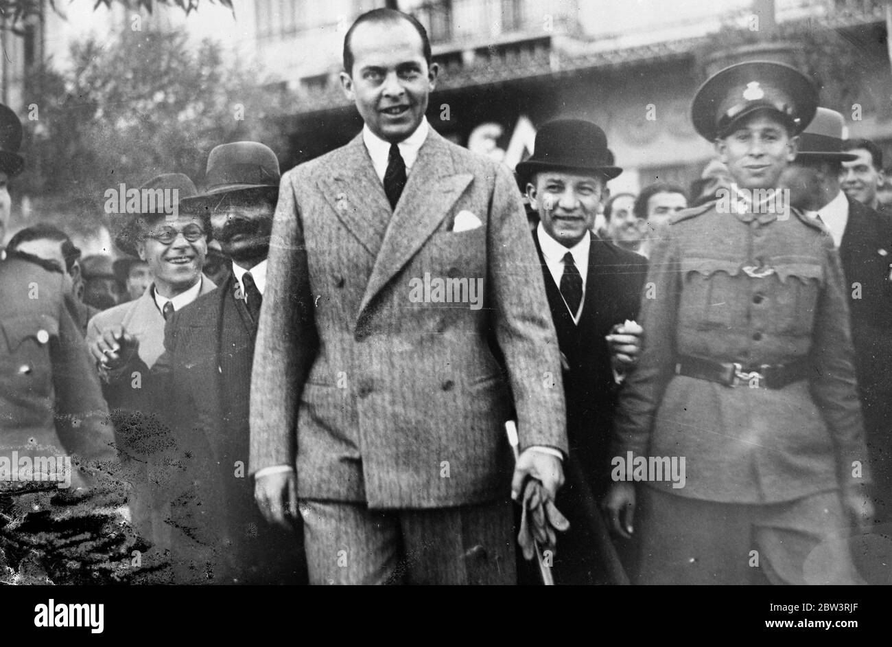 Greek Crown prince appears in Athens streets for first time since restoration of Monarch . Crown Prince Paul of Greece , brother of King George , was surrounded by enthusiastics citizens when he made his first appearance in the streets of Athens since the restoration of the monarch . Photo shows , Crown Prince Paul out walking in Athens for the first time since the restoration of the monarchy . 1935 Stock Photo