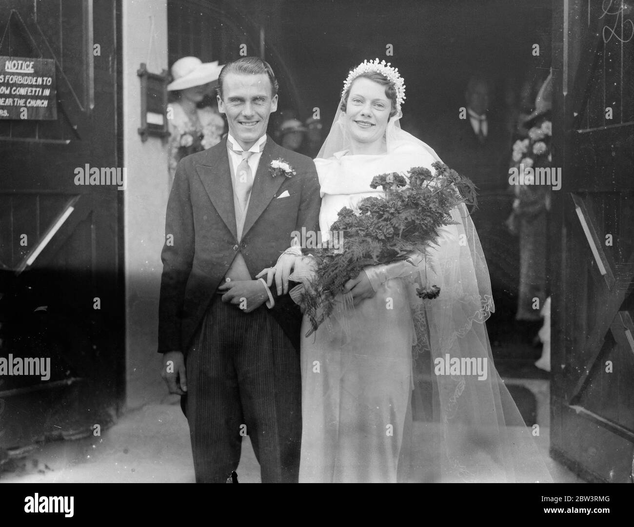 Couple who met in pantomine married . Miss Winifred Wright and Mr Andrew Emm Melville were married at St Stephen ' s CHurch , Clapham . Photo shows the bride and groom . 7 September 1935 Stock Photo