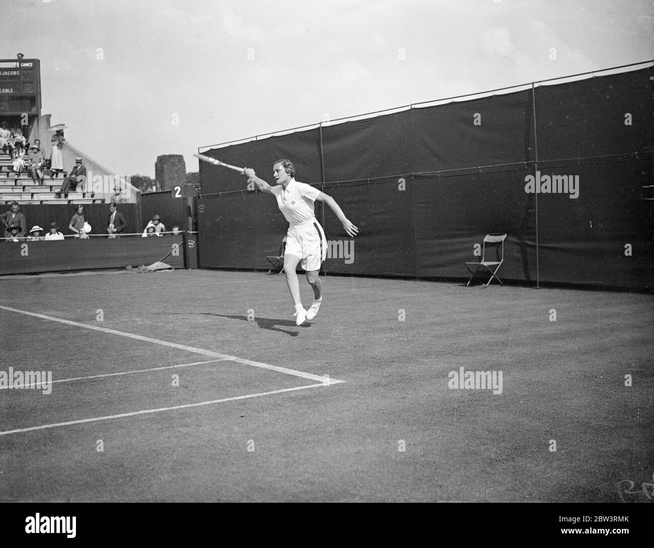 Helen Jacobs Defeats Mrs . Cable In Wimbledon Championships . Miss Helen Jacobs ( USA ) defeated Mrs . M . Cable of Great Britain 6 - 1, 6 - 0 in the first round of the women ' s singles in the Wimbledon Tennis Championships . Photo Shows : Miss Helen Jacobs in play against Mrs . Cable 23 Jun 1936 Stock Photo