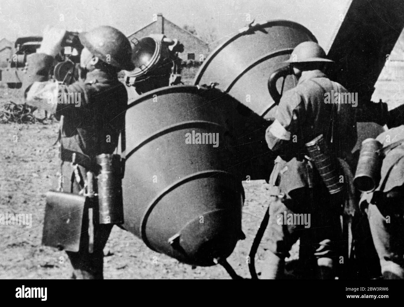 Chinese prepare for Japanese onslaught on Nanking . These pictures , just received in London , show how the Chinese troops , equipped with some of the most modern of war equipment , are making intensive preparations to defend their capital of Nanking against the first onslaught of the Japanese marching on from captured Shanghai . The Japanese have already taken Soochow , on the road to Nanking , and the Chinese Governmenthas been moved 1 , 000 miles further inland . To take the capital the Japanese troops will have to break through China ' s ' Hindenburg line ' . Photo shows, sound detectors u Stock Photo