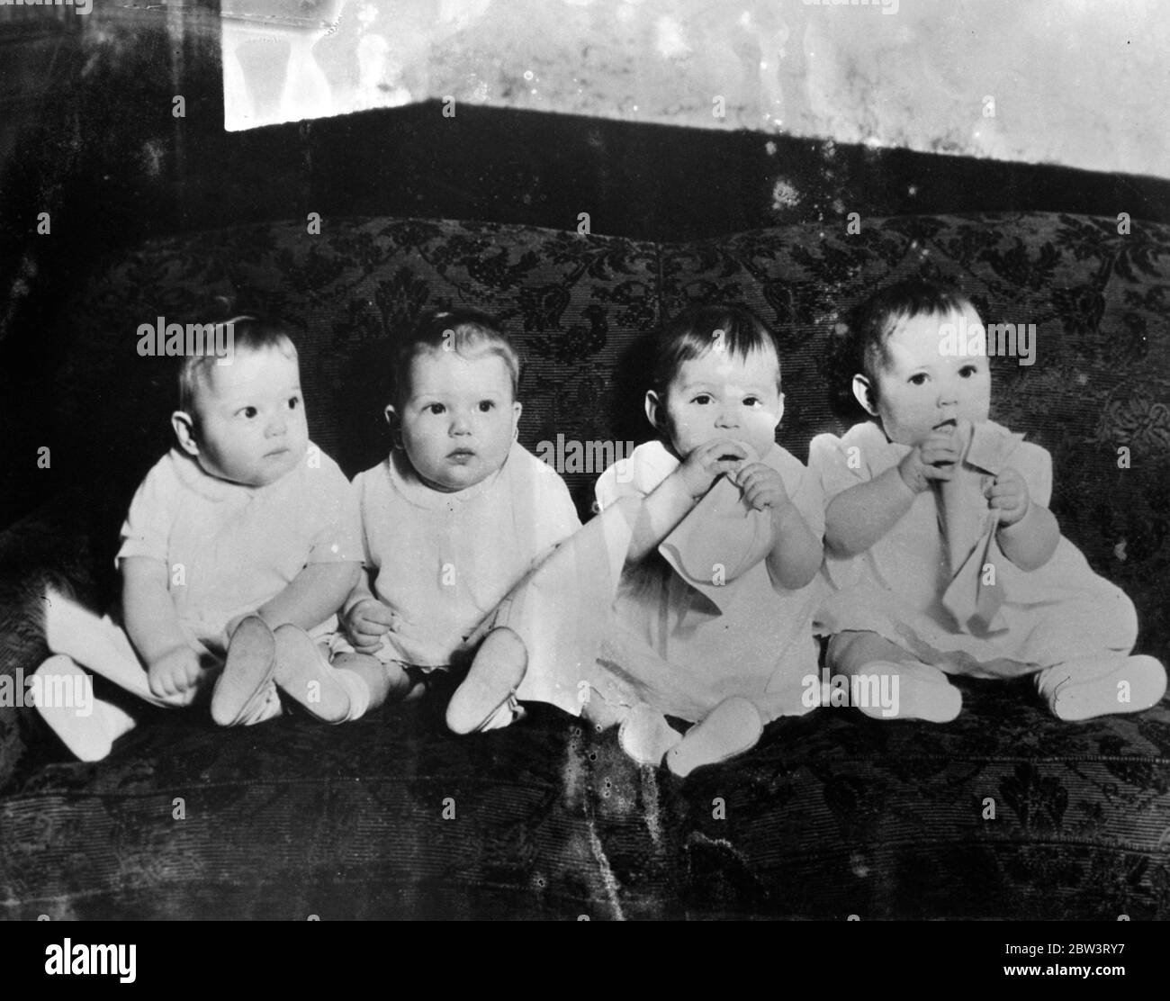Four babies to play the same screen role . Four seven month old babies have been given film contracts each to play the same baby role in the same picture . The children , who appears in ' The Three Godfathers ' are two pairs of twins , Jean and Judith Kircher and Josh and Joan Kelly . Each will alternate in playing the role . As the company will have to work in the heat of the Arizone desert , Richard Boleslawaki , who is directing the film , asked four babies , identical in appearance , so that each will have to work for only a few minutes at a time . Photo shows , the four babies , left to r Stock Photo