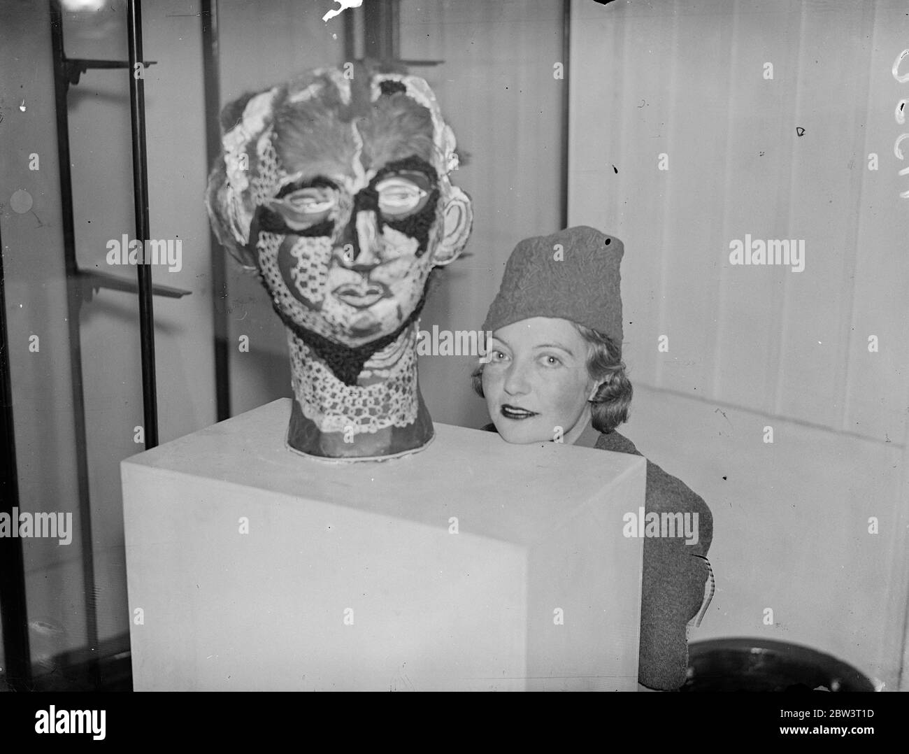 Surrealists exhibit work in London . Works classified as found objects , interpreted objects , porturbed objects and constructed objects are on show at the Surrealist Exhibition opening at the London Gallery in Cork Street , Piccadilly . Photo shows , Miss Eileen Agar with her Surrealist model ' Angel of Anarchy ' 23 November 1937 Stock Photo