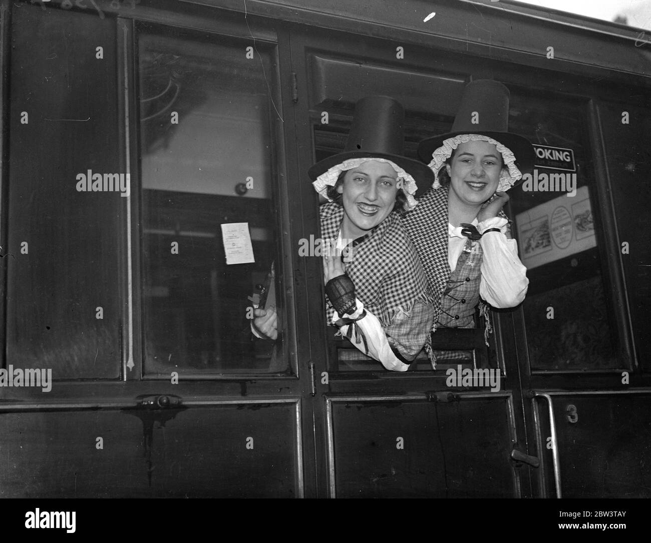 Welsh women choristers leave London for continental  Peace Tour  . Members of the choir smiling as they left Liverpool Street station . 9 December 1935 Stock Photo