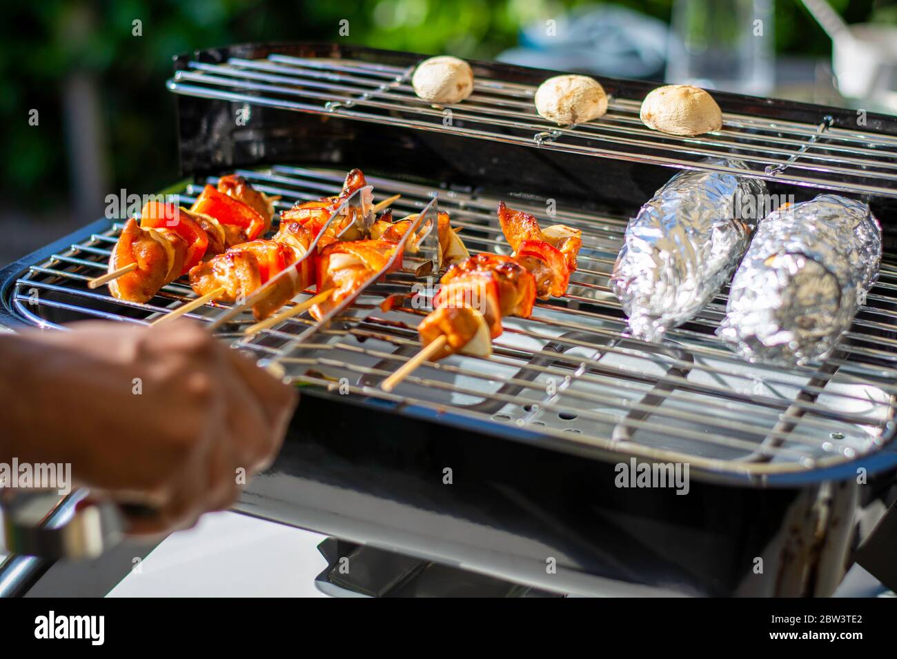 Grilling on a hybrid grill barbecue for electric or charcoal. Marinated ...