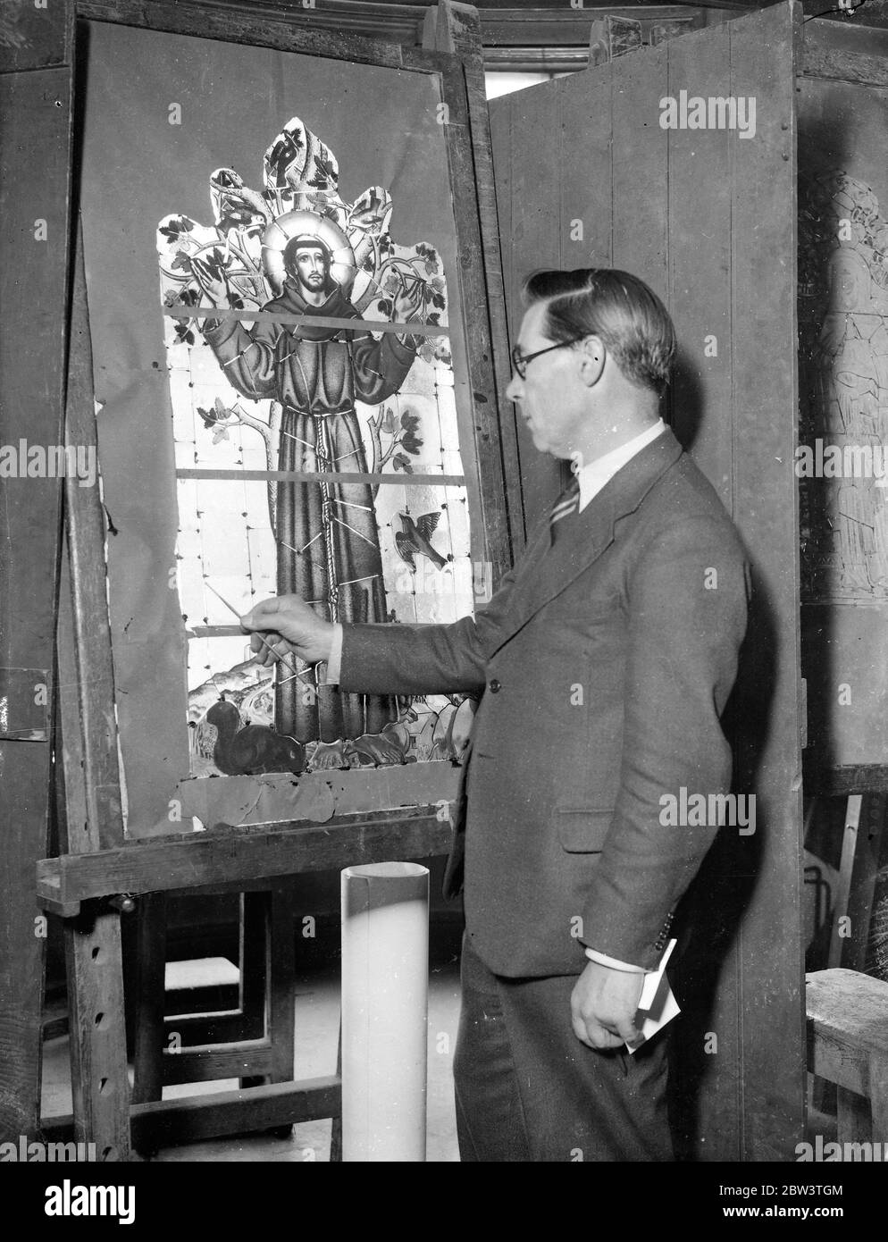 Famous London artist designs window for Christ 's Hospital Girls School . Mr James Hogen at work in his London studio on the stained glass window for Christ 's Hospital Girls School . 27 September 1935 Stock Photo