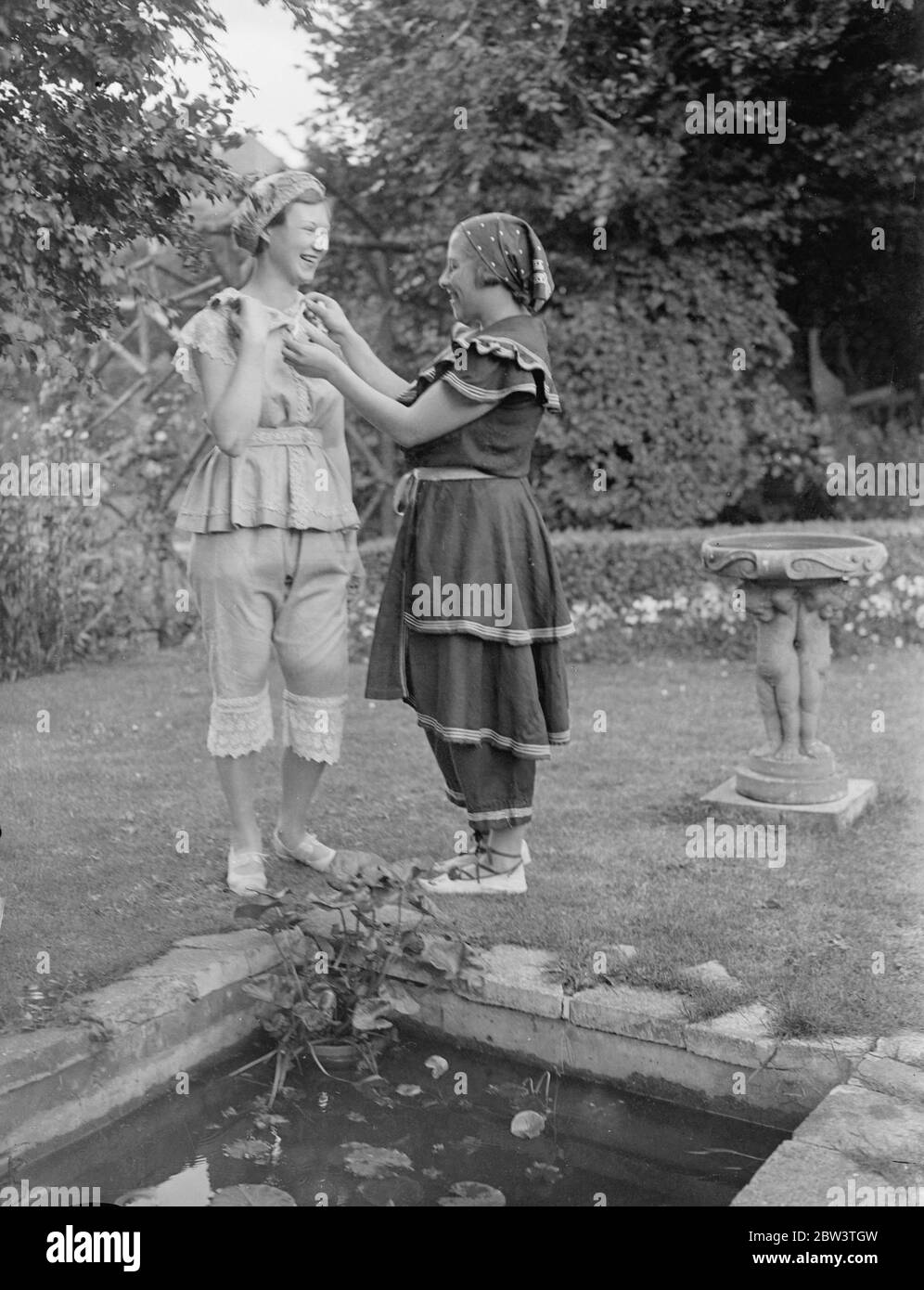 Guests wear bathing costumes of the 19 century at London party . At a party given by Dr W C Cunnington , the North London authority of the Victorian era , women guests wore bathing costumes of the 19 Century . Some of these dresses date back to before 1850 and are the only one of that period in existence . 12 July 1936 Stock Photo