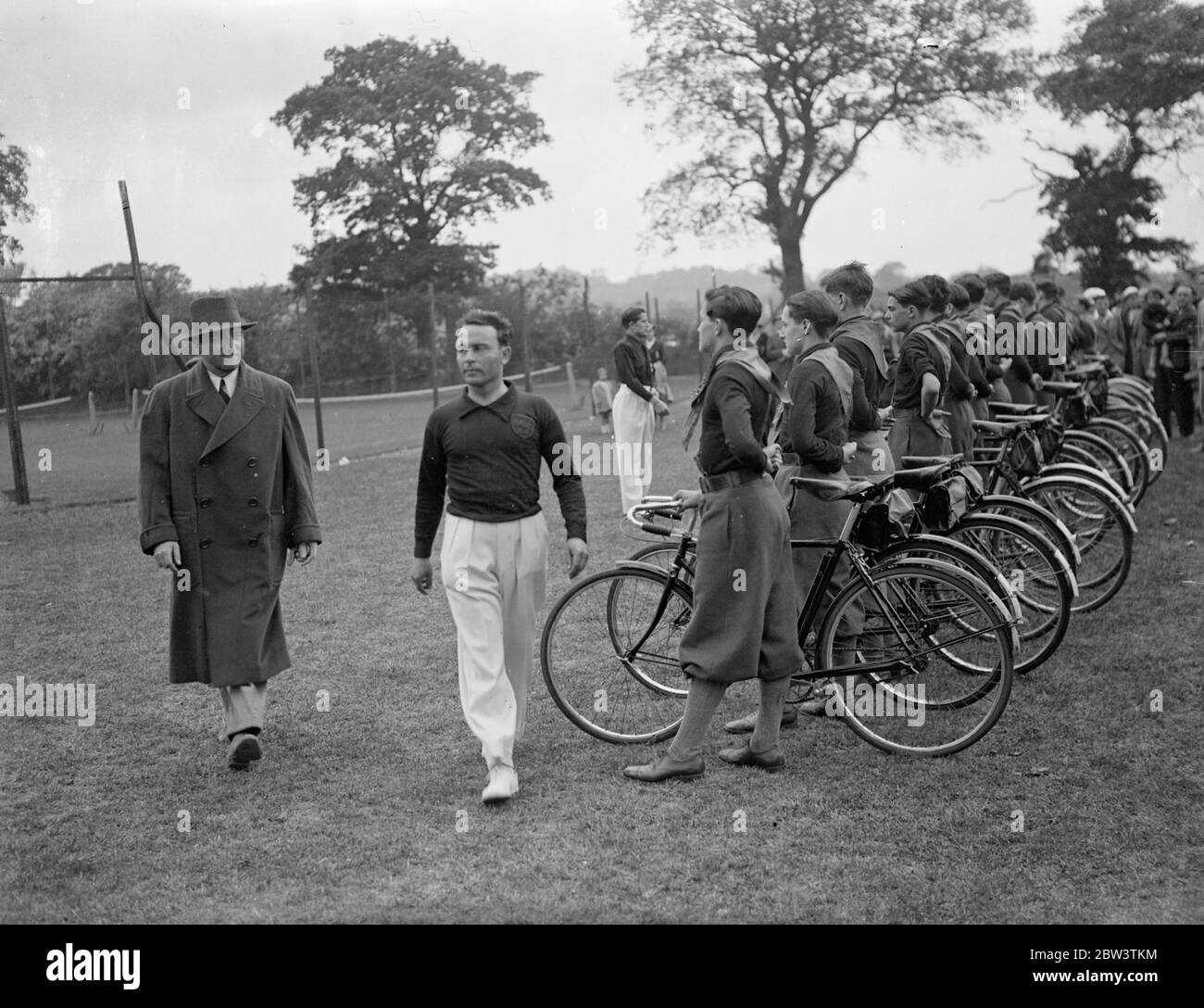Italian Ambassador attends children ' s sports at Edgware . Signor Dino Grandi , the Italian Ambassador attended the annual sports meeting of the children of the Italian colony in London held at the BCI sports ground at Canons Park , Edgware . He was greeted with the Fascist salute when he arrived with Signor Grandi . Photo shows , Signor Grandi inspecting Italian Fascist cyclists . 24 May 1936 Stock Photo