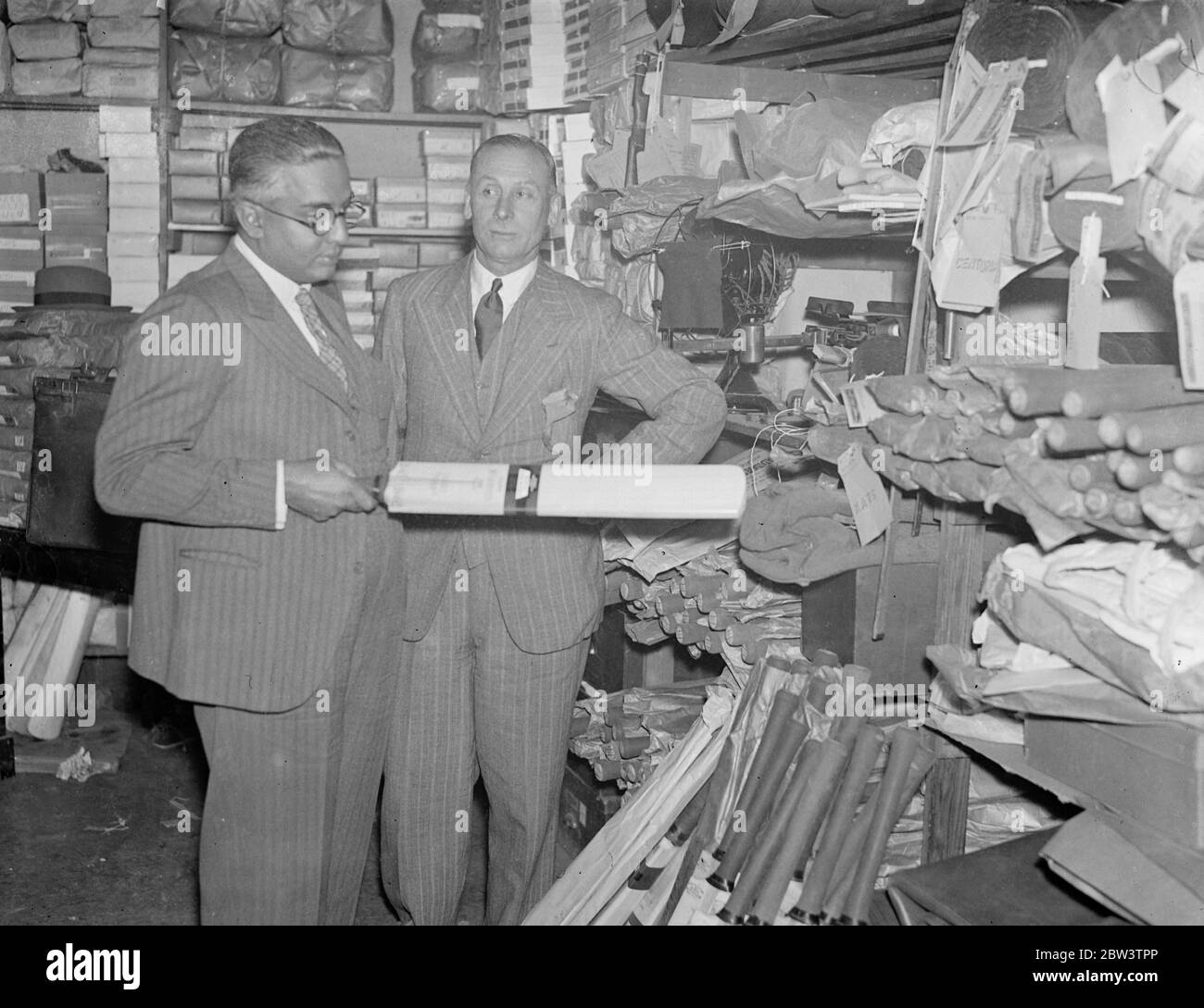 Maharajah Kumar of Vizian Agram , all India cricket captain , selects cricket bats with the help of Jack Hobbs . The Maharajah Kumar of Vizianagram , captain of the All India cricket team which has just arrived for an English tour , received the assistance of Jack Hobbs , batting giant of other days , when he went to Hobbs sports equipment shop in Fleet Street , E C to select cricket bats . Photo shows , the Maharajah Kumar of Vizianagram examining a cricket bat with Jack Hobbs . 17 April 1936 17 April 1936 Stock Photo