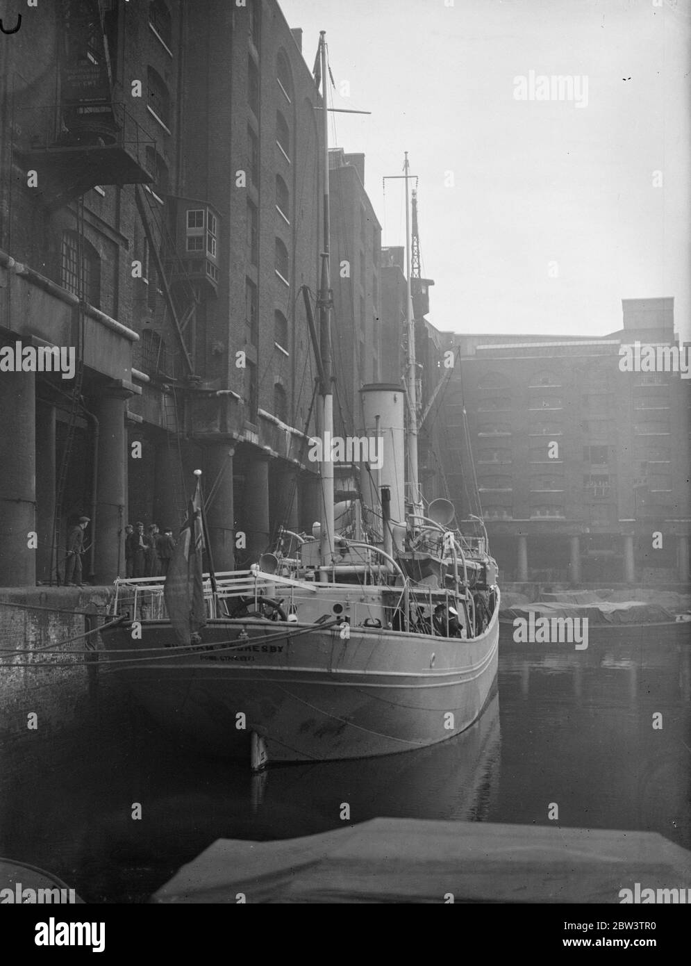 Research ship arrives back in London after seven months in Antarctic . The research ship william Scoresby arrived in St Katherine Dock , London , after seven months work in Antarctic waters . This , the ship ' s fifth visit to the Southern Ocean , was occupied in observing and marking whales . During 120 days on the whaling grounds the William Scoreby steamed almost 17 , 000 miles and marked 700 whales . Photo shows , the William Scoresby after her arrival in St Katherine Dock . 14 May 1936 Stock Photo